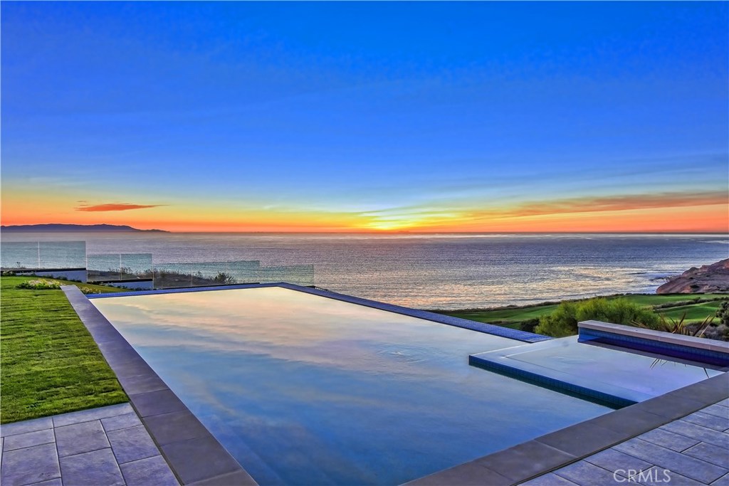 A newly completed home sitting on one of the most beautiful golf courses in the US, it offers panoramic views of the ocean, the golf course, the clubhouse, Catalina Island, and Palos Verdes coastal lines. This fantastic two-story home offers 6 en-suites, wine cellar, movie theatre, 3 car garage, infinity pool, spa, outdoor living area with BBQ, stacking glass walls for openness, and huge windows throughout to bring the outdoors in and enjoying the beautiful views. State-of-the-art appliances in the gourmet kitchen with a very open floor plan of approx. 7,100 sq.ft., video surveillance, elevator, and built-in audio throughout. The owner’s suite includes two walk-in closets, an unbelievable bath, fireplace, and balcony. All en-suits offer view balconies. 24 hr security surveillance throughout this exclusive neighborhood and just a stone away from the clubhouse. A golfer's dream, on this bluff side lot with ever-changing impressive views plus the quality brand new construction, and only a few homes like this in a lifetime. Priced to sell!