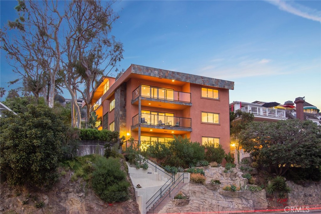 2442 Laguna is a rare fully renovated 8-unit, three-story, ocean view oriented apartment community built in 1964. Located in the city of Laguna Beach, California, situated on .222 acres of land, this property contains one building constructed of wood frame, and stucco with stone accents. The roof system is flat built up. 2442 Laguna is comprised of a majority two-bedroom / two-bathroom units, with an average unit size of 1,124 sf.
2442 Laguna features panoramic ocean and Catalina Island views which enrich every residence—each offering its own unique character through an array of chic features that vary by unit. Recent DRE Approval - Active TIC (Tenant in Common Ownership Structure), which could allow for individual sale of units.
Open floorplans showcase large balconies or expansive rooftop decks, hardwood flooring in a variety of colors, contemporary fireplaces, new windows and glass doors, water- and energy-saving washer and dryer sets, jetted bathtubs, walk-in closets, Noritz instant hot water systems, and state-of-the-art wiring for full HDTV, surround sound, home automation and security systems.
Each unit is centered around a modern chef’s kitchen with island, a variety of solid-surface and stone countertops, Wolf ranges and hoods, Sub-Zero refrigerators, Bosch dishwashers, and sleek new cabinetry. Residents will enjoy easy access to stunningly beautiful beaches and coves, a broad spectrum of restaurants and shops, Laguna’s popular Main Beach, Aliso Beach, parks, hiking trails, and luxe hotels, including Montage Resort & Spa.