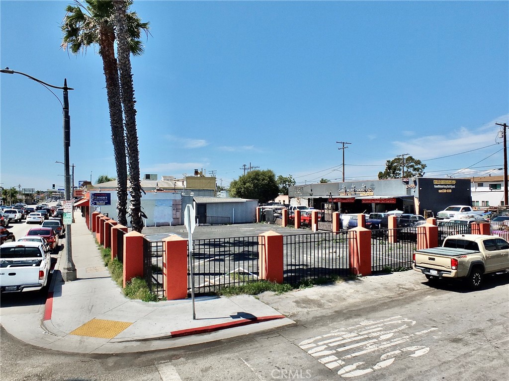 REDUCED TO SELL. This property includes three lots (two joined): APN 7260-023-012 and 7260-023-028 - Great for a mixed use development (see the Property Development Report under Supplements; it includes Maximum Buildable Structure By Right and with Density Bonus). Also, perfect for a restaurant, retail or business along Anaheim Street. Additionally, an auto repair shop at the rear provides rental income (month-to-month lease). Great Investment Potential. Flexible Financing: Cash, Cash to a New Loan or Seller May Carry. DRIVE BY ONLY - DO NOT DISTURB TENANT.