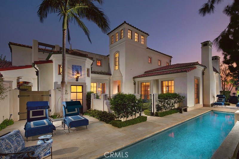 One of the most gracious and thoughtfully designed properties ever to be built in Newport Coast, this luxurious home conceived by the architectural team of Tichenor and Thorp, seamlessly integrates its architecture with its outside living spaces and lush gardens, so that each meld with the other into a singular unified vision and space. This classic Mediterranean-style courtyard home is awash with elegant livability, beautifully proportioned spaces, tasteful details, and stylish finish materials including articulated beam ceilings, intricate moldings, wall niches, limestone floors, iron doors and windows, and Portuguese-style blue and white hand-painted tiles and azulejos. Located in the 24-hour gated community of Pelican Crest, the property has endless unobstructed views, in all directions, of the Pacific Ocean, city lights and Newport Harbor. The home functions effortlessly with all of the its primary spaces on the first level including the master suite, living room, family room, formal dining room, kitchen, morning room, gym, and den. An elevator serves the upper level which houses a library, den/office and private bath, two bedrooms with en-suite baths, a tower and a telescope observatory with a retractable roof. Outside there is a pool and spa, loggia with a fireplace, sweeping ocean views and “Old California” gardens, richly layered with Aleppo Pines, boxwood, camellias, Agave, Torch Aloe blooms, succulents, citrus, roses, Olives, pea gravel paths and stone walkways.
