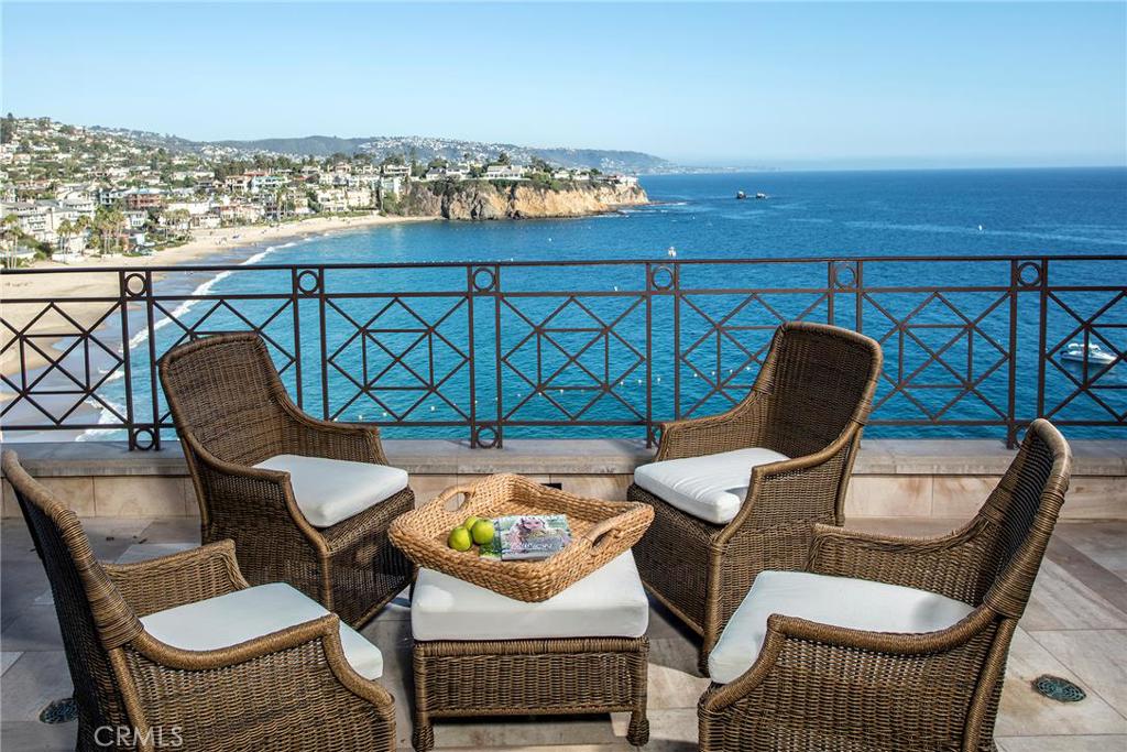 EMERALD BAY OCEANFRONT. One of the finest Emerald Bay homes, prominently positioned directly overlooking the Private Beach with breaking surf. The views are spectacular, coastal Laguna all the way to Dana Point. With the perfect orientation making for morning sun on the balconies and sparkling city light viewing at night. The formal entry is incredible with a two story floor to ceiling view window and a huge retractable skylight. This is a turn key home with sensible and useable living spaces. The elevator services all three levels. There is a terrific family room with wet bar and a very private spa on the bluff. Gourmet kitchen. Six bedrooms, six and one-half baths. One bedroom has it's own private entrance, perfect for a maid's quarters or live-in. Of course, Emerald Bay offers a private beach, 24 hour guarded access, tennis courts, swim complex, children's play area and wonderful setting in North Laguna Beach
