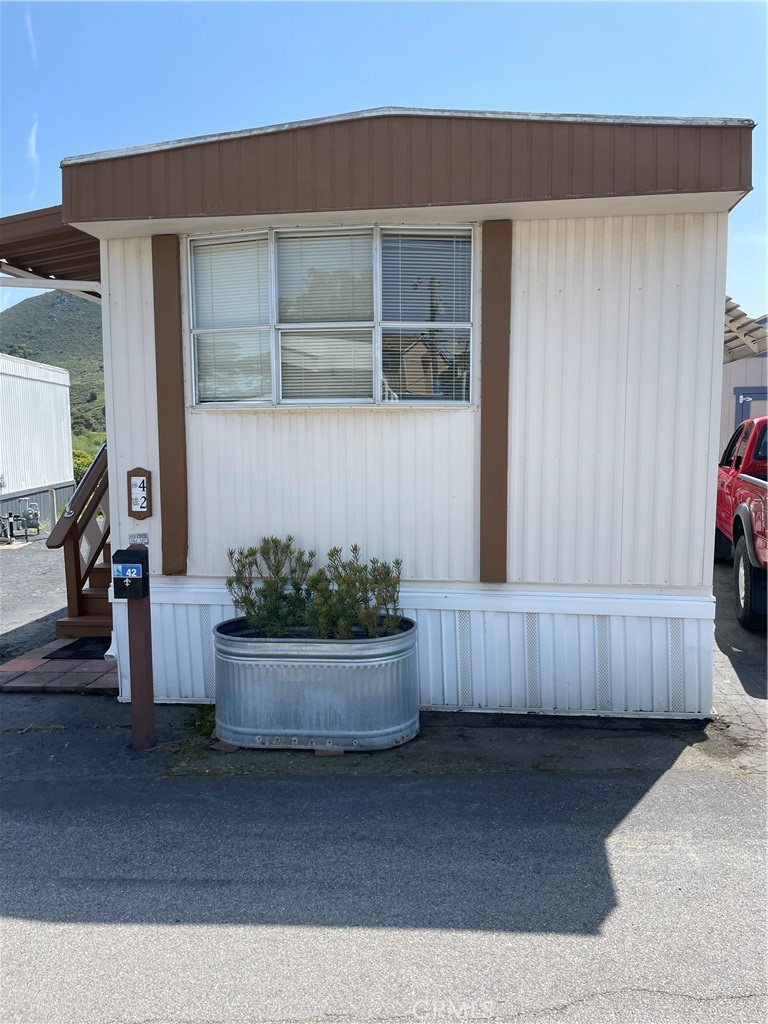 Great views at an amazing price! This 1979 single wide rests on the top of the hill in the beautiful Blue Heron Terrace Mobile Home Park of Morro Bay. Included are all the appliances including the washer & dryer, shed, newer laminate flooring and kitchen cabinets. There is a panoramic view of the rolling hills, Hollister Peak & the nature filled estuary. A walking path at the rear of the park leads you around Black Hill to the Morro Bay Golf Course, The Bayside Cafe, kayak rentals, boat docks and the Natural History Museum. Morro Rock and endless soft sandy beaches are just about a mile away. It's a nice time of year to relocate to the coast. The weather is fantastic, the night time sky is clear and full of stars. If you are looking for a full time residence or a part time beach get a way, this is it! Come and live at the coast, breathe the fresh air and listen to the crashing waves of the Pacific Ocean.
This is an all age rent control park. The current space rent for this home is $896.56 monthly.