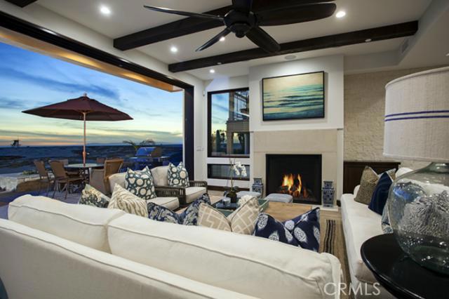 Just steps to the pier this remarkable brand new construction sits on Balboa's highly sought after boardwalk on the Newport Beach Peninsula. Beach chic yet elegantly constructed 4 bedroom house features breathtaking white water views from both levels. A gourmet kitchen with a 48” Wolf range and appliances opens to the dining room and living room creating an great room feel ideal for entertaining and capturing the beach views. The master retreat is complete with a sitting area, freestanding Kohler tub and fixtures, a balcony and large windows boast a 180 degree views of the Catalina sunsets. Quality craftsmanship and attention to every detail can be seen throughout the home with premium DuChateau plank hardwood flooring, surround sound, alarm system, central vacuum, top of the line Anderson windows, wood beam ceilings, and lovely detailed stone and tile work. Complete with a custom 9 foot flush track life and slide Weiland front door opening to the oversized front entertaining patio is the perfect place to enjoy the boardwalk and views while sitting by the gas fire pit.
