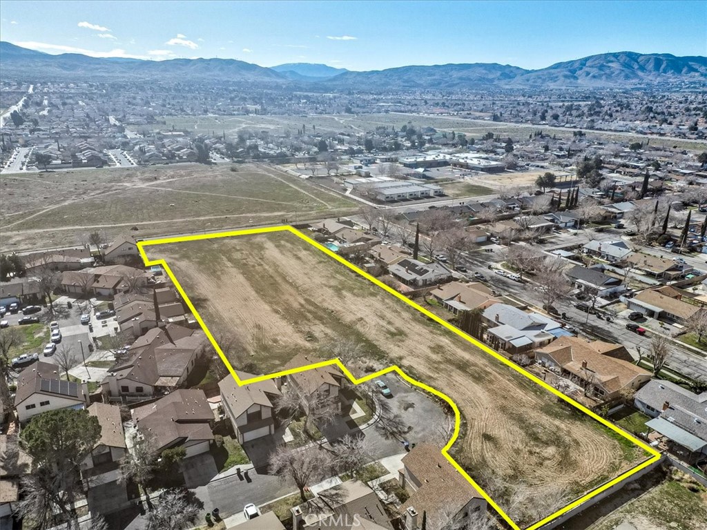 Seller financing available! Appraised on February 15, 2023 for $900,000. Property is zoned RN2, which allows a minimum of 20 units (10 units /acre), but a maximum of 40 units (20 units/ acre). Incredible opportunity to purchase a FLAT empty lot that is surrounded by single family homes. Property boasts over 90,000 square feet and can be subdivided into smaller individual lots or possibly develop multifamily. Because the property is surrounded by homes, the property should be near all the utilities: electric, gas, water and sewage. Depending on how aggressive the offer price is, seller may be open to providing seller financing. Buyer to verify with the city and submit all proposals to building and safety. Buyer understands that in order to build, they will need plans to be ready to issue (RTI). Be sure to checkout the supplements to see the appraisal report. The sale is for two lots ending with APNs 26 and 27.