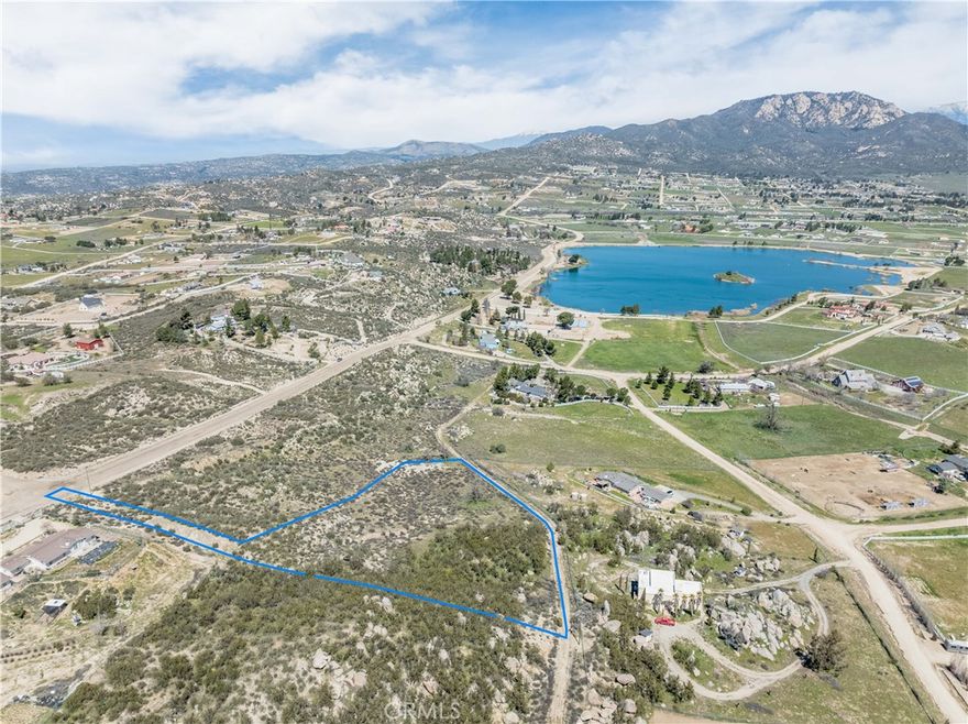 This flag lot is conveniently located just a short two-minute walk from the picturesque Lake Riverside and community center. Lake Riverside Estates community offers attractive amenities which include fishing and boating, horse trails, an equestrian center, bicycle pump track, basketball and volleyball courts, swimming pool, gated entry, and a private airstrip. The lot itself is currently in its natural state, consisting of rock outcroppings, a variety of native flora including desert sage and manzanitas, and a small seasonal creek. Aguanga offers an abundance of space and quiet, while still being conveniently located just 25 minutes from Temecula. Come build your dream home in this growing community, surrounded by the natural desert landscaping and stunning lake and mountain views.