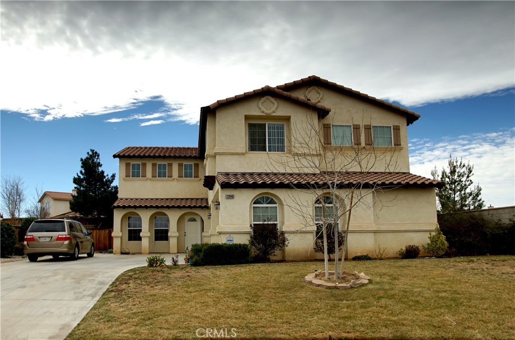 This spectacular 4 bedrooms 3 bath two story villa is located at the end of a cul-de-sac in the quiet Eagle Ranch neighborhood. It features a high ceiling entry room, hardwood and tile floors, and a gourmet island kitchen. There is also a bonus office nook that can be used as game room or home office. The spacious master suite comes with a private balcony and a fully stocked bathroom. The 3 car attached garage leads to a huge backyard with RV access. The location is close to shopping and schools. This property is a rare gem for the offered space.