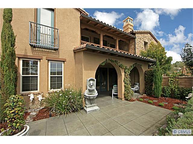 Castellina embodies the time-honored essence of a Tuscan hilltop village. Gracing a panoramic view lot in the prestigious guard
gated community of Covenant Hills, this luxurious attached villa is rich in detail and amenities. Encompassing 3 bedrooms and 2.5
baths, this highly upgraded residence offers gracious proportions and a stunning level of refinement with finishes of walnut and
granite. Highlights include exquisite dark hardwood floors, a rustic stone exterior with a stately four car paverstone driveway,
gorgeous center island kitchen with premium stainless steel appliances, built-in refrigerator/freezer, downstairs den with double
entry doors, a spacious master suite with a covered veranda and an inviting great room featuring a cast stone fireplace, media
niche and French doors leading to a covered loggia. A private rear yard, ideal for outdoor living and entertaining completes this superior quality home. Top schools, clubhouse, trails, parks and swimming pool all near by. It's a truly immaculate property.