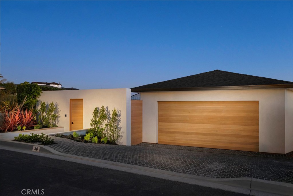 This newly constructed oceanfront masterpiece is nestled within the prestigious and secluded enclave of Three Arch Bay.