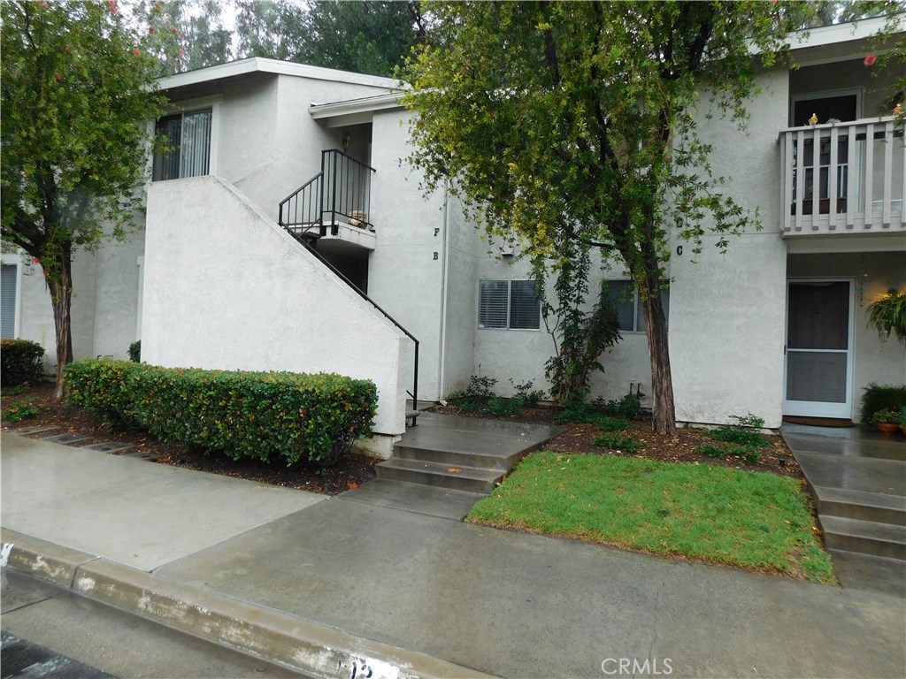 ground level condo with a huge enclosed concrete patio. THE HOME HAS BEEN FRESHLY PAINTED AND HAS LAMINATE THROUGHOUT INCLUDING BEDROOMS. NEW WINDOW COVERINGS AND CEILING FANS IN BOTH BED. UPDATED KITCHEN ELECTRI OVEN/STOVE TOP, WALL HEATER. ONE ASSIGNED CARSPACE AND LOTS OF OPEN PARKING. BELONGS TO LAKE MISSION VIEJO. INCLUDES FULL SIZE WASHER AND DRYER AND REFRIGERATOR