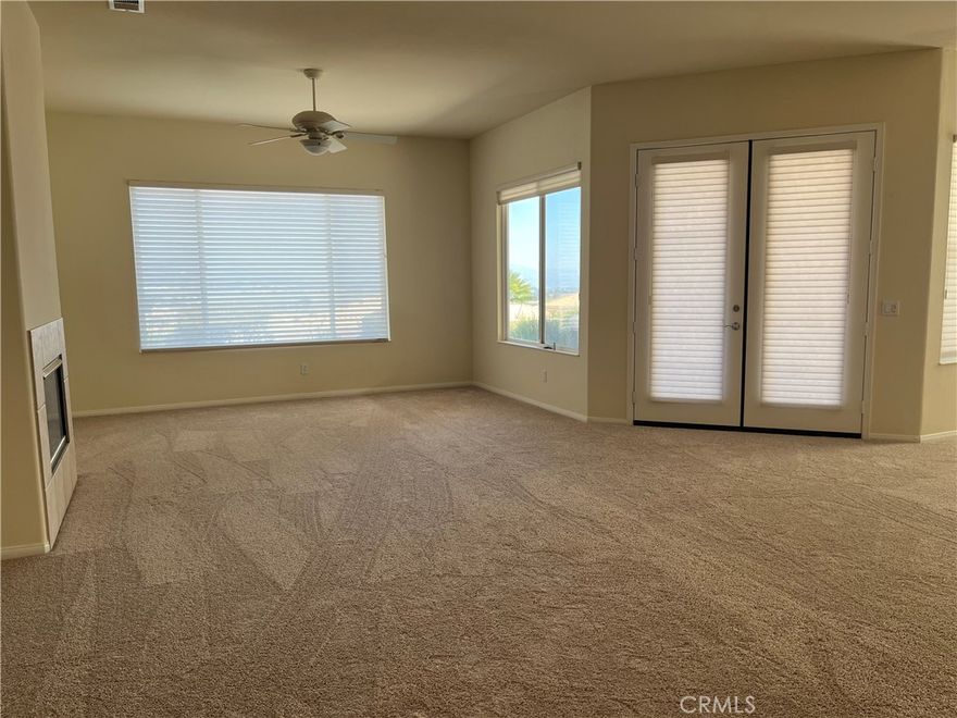 Price decreased!  Move right in to this turnkey, gorgeous home with an extraordinary amazing view of the valley and mountains!  Live in an active 55+ community in Sunlakes Country Club! This home features 2 bedrooms, 2 1/4 bathrooms and an extra room for a den, library, office, etc. The kitchen is a very nice size with a large island and opens into the dining room/living room. The living room has a fireplace and a big size window to look out over your panoramic view of valley and mountains! Each bedroom has their own bathroom and walk in closets. The master has a separate shower and a jet tub for relaxation! Inside laundry room. It is located on a cul-de-sac and has a 2 car garage and a single side for your golf cart! The back covered patio has awesome, magnificent views that is rare to find! The community has over 70 social clubs, 2 golf courses, 3 gyms, 3 pools and spas, bocce ball, tennis and pickle ball courts, club houses, RV parking lot, restaurants, a lounge, ballroom and weekend live entertainment plus more! No melloroos! It's resort living everyday! Close to shopping, outlet stores, casino, freeway access, Palm Springs, hospital and medical offices and restaurants. Come see this beautiful, popular Emerald floorplan with it's views and make it your home!