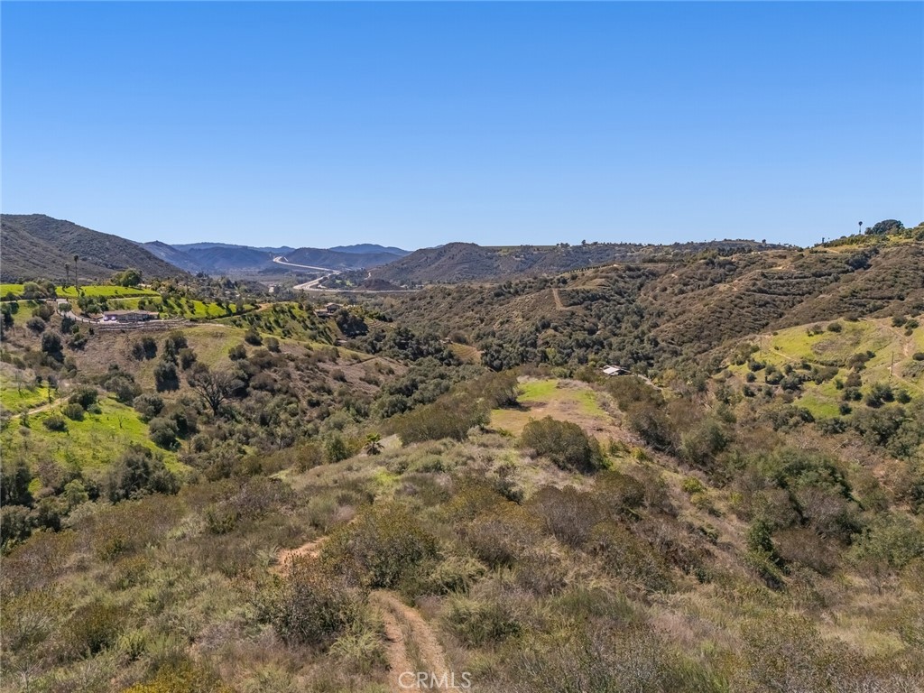 We are excited to share an incredible opportunity to embrace tranquil country living with a vast 21.8-acre lot now available in Fallbrook, CA. This expansive property offers immense potential, whether you're looking for a sound investment or a picturesque setting to cultivate your passions.
Imagine the possibilities with over 20 acres at your disposal, all within easy driving distance to both San Diego and Orange County. This versatile parcel is ideal for establishing an avocado or citrus grove, or even planting your very own vineyard. Beyond its agricultural potential, the location offers a relaxed lifestyle with access to excellent schools, charming shops, diverse restaurants, and fantastic local wineries.
For nature enthusiasts, the surrounding area provides stunning landscapes, including numerous hiking trails, golf courses, and the beautiful Santa Margarita River, all conveniently within reach. Access to the parcel is readily available off Taza Road.
This is a truly exceptional chance to own a significant piece of paradise in Fallbrook and build the dream life you've always envisioned. Please let me know if you would like more information or to discuss this unique property further.