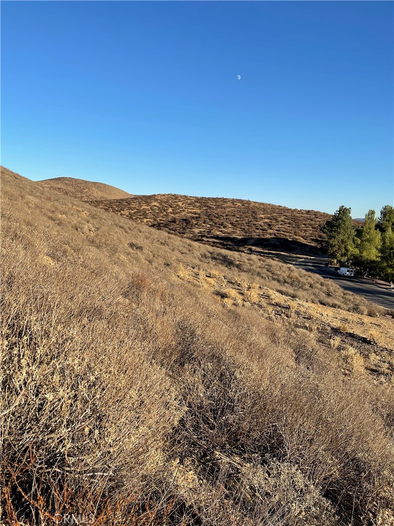 vacant lot in a fast growing area in Menifee with lots of homes nearby. With quick access to Newport Rd and 215 freeway, this property seamlessly combines the tranquility of a custom home neighborhood with convenience of urban living. It slopes up to the side of the hill with panoramic views of the valley and mountains. Power line and water line are on the street. Do not miss this opportunity to make your dream come true .