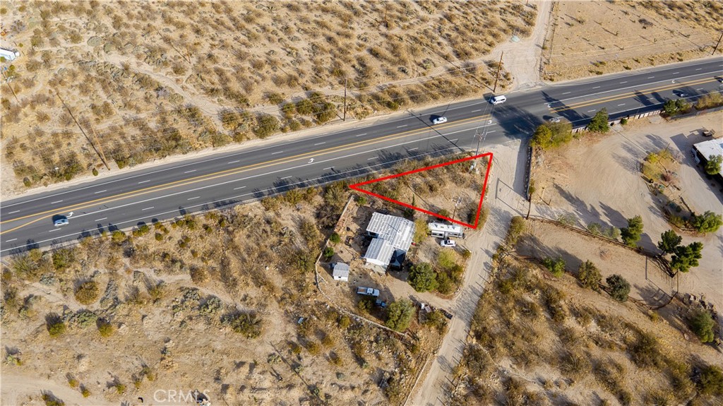 .22 Acres. Address is just for listing purposes. Address does not exist. Vacant Land situated on the corner of Fobes Road and Highway 62 in Morongo Valley. Triangle shaped Lot, zoned MV-RL. Great for building new construction. Has electric on lot, come make it your own! About 20 minutes from Joshua Tree National Park. About 25 minutes from Palm Springs airport. A wonderful central location in up and coming Morongo Valley. Call agent with any questions.