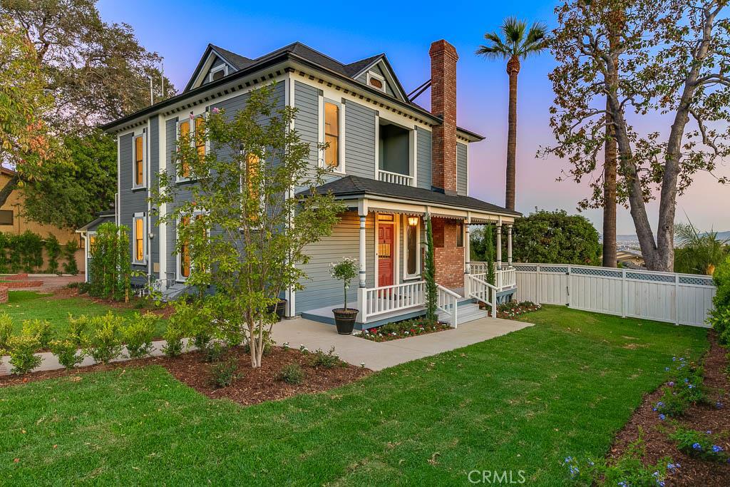 Welcome to this fully refurbished Victorian with incredible views. Nestled on a large lot in North Monrovia this home offers the charm of a character home with all the comfort and convenience of new.
* Classic wrap around porch sets the stage
* A foyer entrance leads to a grand living room with high ceilings, large windows with city views, beautiful Victorian woodwork and a Carrera marble accented fireplace
* Formal dining with views of the Foothills
* Remodeled kitchen with granite counters and stainless appliances opens to a breakfast nook with attached ¾ bathroom
* Den/office with double French doors that open onto a deck with endless views of the city (could be used as 4th bedroom)
* A grand staircase leads upstairs to a Juliet balcony, two secondary bedrooms, a full bathroom, and separate laundry room
* Also upstairs is the breathtaking master suite with floor to ceiling windows to soak in the city lights view, a large walk-in closet & custom master bathroom with oversized shower
* Two car detached garage plus lots of surface parking
* Backyard features pool and spa with gated grass area
* Front yard has a brick patio, statement tree and endless lawn behind a white picket fence
* A rare opportunity … views, charm and move-in ready!