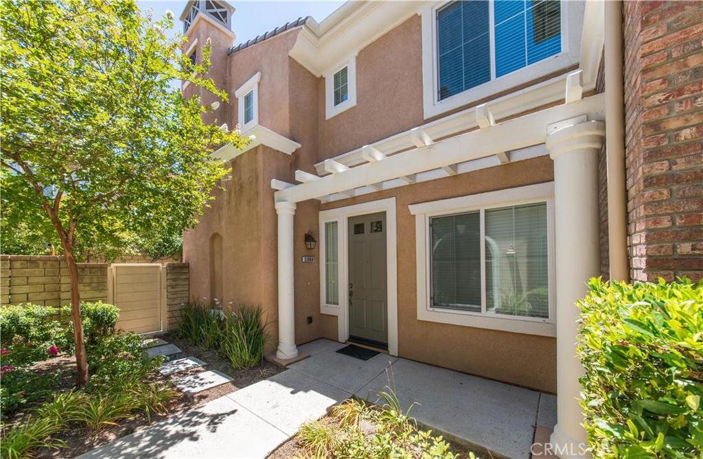 Gorgeous Artenati in West Creek area of Valencia! This turnkey condo is 3 bedrooms and 3 bathrooms. The entire home is done in neutral colors offering laminate flooring downstairs and tile in the kitchen. The kitchen offers beautiful granite counter tops, tons of cupboard space for storage and stainless steel appliances. There is a separate laundry room off the kitchen that has washer/dryer and shelving space and a powder/guest bath. The 2 car garage offers extra overhead storage with a newer water heater that is just a year old. There is a separate dining room off the kitchen as well. Upstairs you will find the bedrooms which are good-sized. The stairs and upstairs hallway are done in light wood flooring. The decor is very neutral so you can just move in and take advantage of the blank canvas. There is a guest bath upstairs of the secondary bedrooms. The master is large and has a full bath with spa like soaking tub and separate shower and extra shelving in the large walk-in closet. The backyard has plenty of room for BBQ, sitting area and play area for kids. This unit offers privacy and is in a very quiet area of the complex. The unit has spa like amenities adjacent to Olympic size pool in gated common area.