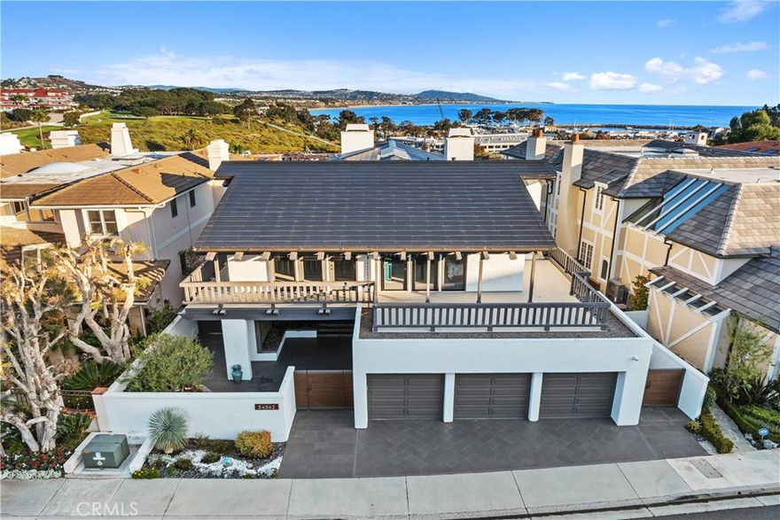 Welcome to Lantern Bay Estates, an exclusive, gate-guarded community perched above Dana Point Harbor, offering breathtaking panoramic views stretching from Point Loma to Dana Point Harbor.



This home has been completely remodeled to embody modern coastal living, blending elegance with functionality. At its heart, you'll find a Tesla Glass Solar Roof, two Tesla Power Walls, a new HVAC system, Pex plumbing, tankless water heater, a whole-house fan, and a state-of-the-art smart home system.



Upon entry, you are greeted with expansive, breathtaking views that serve as the perfect backdrop for every space. From the elegant six-seat wet bar with a beverage cooler and Scotsman ice maker to the living room, dining room with custom ten-seat dining table and kitchen, every room is designed to capture the picturesque setting. Enjoy sweeping views of the harbor, ocean, whitewater, city lights, sailboats, and surrounding hills.



The chef's kitchen is a dream come true, open to the living area and equipped with top-of-the-line appliances, including a Wolf range and Sub-Zero refrigerator. A large island with seating for ten and abundant counter space makes this space perfect for entertaining.



Throughout the home, a new Security System, Lutron electric blinds and a Control4/Sonos automation system, five Frame TV's with smart remotes, add effortless convenience. Wine enthusiasts will appreciate the private wine cellar, ideal for storing and showcasing a curated collection.



The primary bedroom suite offers an unparalleled retreat with expansive views, a cozy sitting area, and a luxurious en-suite bathroom. The secondary bedrooms also feature en-suite bathrooms, perfect for hosting overnight guests.



The outdoor spaces are just as impressive, with newer decking, vanishing screens on the doors, and seamless indoor-outdoor living. The exterior of the home has been meticulously maintained to include with refinished walls, a pristine three-car garage complete with built-ins, and a private courtyard. The spa is placed so you can enjoy the view and has a retractable awning for added privacy. 



Situated at the end of the street, the property provides direct access to Heritage Park. Additionally, it's within walking distance of the newly revitalized Downtown Dana Point, offering fine dining, the Dana Point Harbor, and local beaches.



This home epitomizes the ideal coastal lifestyle, combining luxurious living with an unbeatable location.