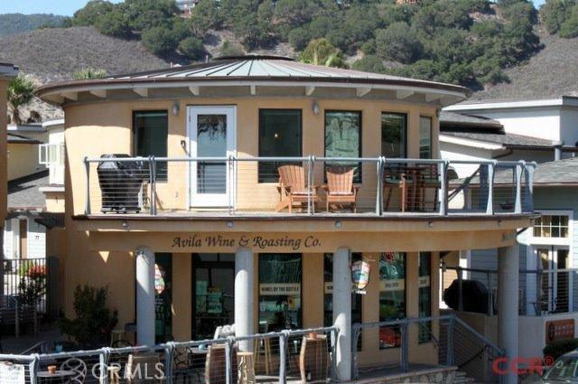 Unique luxury ocean view studio condominium in The Courtyard at Avila! With an unblockable ocean view from your wrap-around deck you can enjoy the quintessential atmosphere of Avila Beach while barbecuing and people watching. This Licensed Vacation studio is perched above Avila Wine & Roasting Co. and sleeps 4. The circular floor plan features wood flooring, granite counters, stainless appliances, a gas fireplace, and high ceilings. Courtyard at Avila has a private gated entrance leading you into the beautiful common area courtyard offering water fountains, sea art sculptures and access to a secured parking garage with two parking spaces and a storage locker. Perfect second luxury beach home or vacation rental. This is an ideal location within 50 feet of the beach, great restaurants, wine tasting rooms, the Friday night summer Farmer's Market, concerts, shopping and the Avila Bay Golf Resort across the way. Enjoy the vacation life and wonderful weather that Avila Beach has to offer!