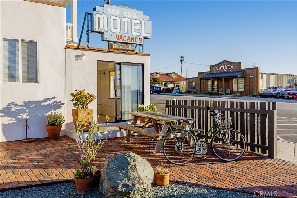 A premier investment opportunity, this Spanish Mediterranean property has it all. Zoned commercial, residential, and hospitality, the possibilities are rich. Situated a block from the heart of beautiful downtown Cayucos, this prime corner property includes a completely renovated 3 bedroom, 2 bathroom main residence with basement. Adjacent to the main house is a free standing 2 car garage with a 1 bedroom guest suite above that is slated for redesign. Included in the sale is a boutique motel with options for 2 suites with full kitchens, or 4 separate units if desired. The motel, modernized while capturing the classic feel, was the first to operate in Cayucos in the 1930's and features a small office. There are 5 parking spaces on site as well as 2 private spaces accessed from Pacific Street. Within 500 feet of the beautiful sandy beaches, this downtown parcel consists of 4 underlying lots, opening up the possibility of additional development. With a population of nearly 3,000, Cayucos is one of the most idyllic places to live in California and this is a rare opportunity to own an iconic beach town property with ocean views. Established short term rental business/hospitality designation offers a variety of options for the new owner.