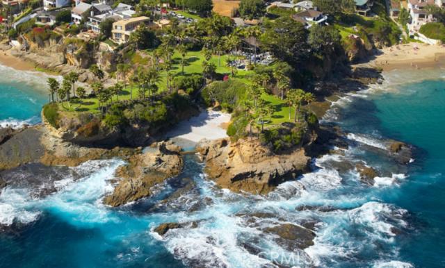 ‘TWIN POINTS’ is a landmark 2.28 acre oceanfront estate on the coast of Southern California. Majestically situated, its 1,400’ of waterfront includes two massive landforms projecting into the ocean. These ‘twin points’ shelter its private cove that lies between. Magnificent tropical gardens and lawns contrast against the buff-colored cliffs and azure waters, creating an enchanting setting. Specimen palms dot the bluffs and define the open expanses. Multiple exposures capture endless panoramas of the ocean, Catalina and sunsets. At night, the entire coastline of Laguna is alight.‘Twin Point’s privacy is unmatched. Behind its gates, improvements include a motor court, a Polynesian-themed main residence + guest house. A pool and terraces await repose. Meticulously kept, these elements complement the setting and subtly bring order to an environment directed to the out of doors. A cove with private access further distinguishes the estate and adjoins a lagoon. Situated amid picturesque coves often referred to as “the most beautiful mile of coastline anywhere,” this property is the centerpiece. Held in the same lineage since 1930, Twin Points’ history is a storied past of seaside days, stylish parties and summer evenings spent overlooking the ocean and sunsets.