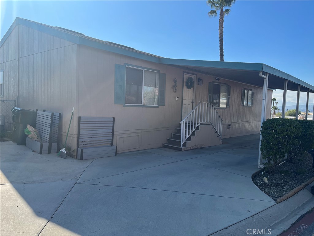 Well Maintained, 4 bedroom, 2 bath in a great community with Great views. This home is spacious with a living room and a spacious kitchen and dining room with great views. Four bedrooms including main suite that has own bathroom. All bedrooms are spacious with a few with walk-in closet. Property has a backyard fully fenced with landscaping and has a back covered patio with views. It also has a covered car port in front. Huge community with a club house, 2 pools, playground, tennis court, outdoor BBQ and much more. Centrally located, close to schools, shops, entertainment, golf courses and freeways (91,60 and 15).