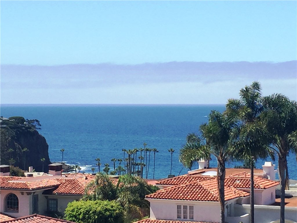 Magnificent, custom home in prestigious Irvine Cove w/ unobstructed 180’ panoramic Pacific Ocean views! Owner-designed, guard gated estate on cul-de-sac w/extended driveway, 5 car garage, & private beach access! Vacant lot above. Elegant stone exterior. Coastal dreamhouse w/2 story volume ceiling ocean view living rm w/fireplace. Separate formal dining w/breathtaking ocean views, & door to kitchen. Gourmet kitchen boasts granite counters w/full height backsplash, 5 burner stove w/grill, dbl oven, farm sink, & coveted ocean views! Family rm w/wood flooring & walls, relaxing fireplace, & granite wet bar. Large main floor guest suite w/full bath, mosaic floor, frameless door shower & mirrored wardrobe. French door to entertainer’s yard w/ covered patios, slate patio, artificial lawn, spa w/water feature, & citrus trees. Stunning ocean views abound! Main floor laundry w/sink, beach shower, & pantry. Upstairs master suite w/spectacular ocean views, & walkout balcony. His & her bathroom w/separate toilets, luxurious tub, glass enclosed shower, & large walk-in closet. Room w/dual closets & dedicated bath w/shower. Giant bonus rm w/closet. Bath w/shower/tub, stone counters, & travertine floors. Marble flooring, berber carpet, fresh paint inside & out, ADT security sys., built-in speakers, & dual A/C. Built-in garage work bench & attached hobby room w/sink. Minutes from iconic charm of historic downtown Laguna, shopping, dining, Pageant of the Masters, festivals, & art galleries.