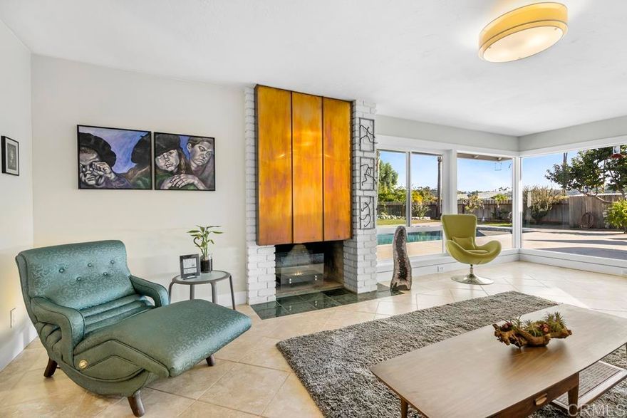 Welcome Home to this SINGLE STORY, Custom Home in the coveted development of Bonita Woods | Mid Century Modern with a Palm Springs Vibe | Windows galore! | 2858 SF | 4 Bedroom and 4 Bathrooms | 3 Baths are fully remodeled with custom-built floating vanities and custom deco tile in each | Large Open Concept Kitchen and Dining Room | Large Family Room with Gas Fireplace | Spacious Living Room with Fireplace and custom copper art-deco feature | Separate Entertainment, Study or Office Room with Wet Bar and Refrigerator | Custom, Built-In Aquarium | Recessed LED Lighting in Main Living Areas | Lots of Natural Light | SOLAR and A/C | Upgraded Windows and Sliders throughout | Newer Duct Work throughout | ½ Acre Square, Flat, Usable Lot – fully fenced back and side yards | Mature, Producing Orchard with Grapes, Apricots, Apples and a Variety of Citrus | Mature Landscaping with a variety of trees | Bright and Open Courtyard and Entry| Plenty of Room for a possible ADU | Large Covered Patio | Bricked Garden Planter – Grow your own food! | Lots of Open Space | Room for Boat or RV parking | Zoned for Horses, Chickens and Bees | County walking trails webbed throughout the neighborhood | Near Nature Preserves and Rohr Parks, Dog Park, Close to Golf, Shopping and 54 and 125 freeways | No HOA or Mello Roos | This opportunity will not last!