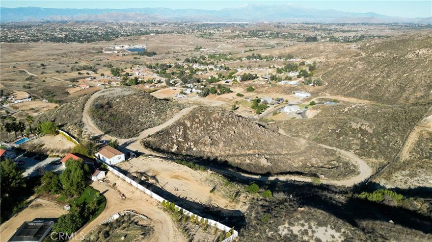 Welcome to a rare opportunity that includes two separate parcels totaling 20 acres, both with addresses. The main property at 15875 Vista Norte, APN# 287-040-014 and an additional 10-acre parcel, 15955 Vista Norte, APN# 287-040-015 directly in front, offering expansive panoramic views of Lake Mathews and surrounding.



Comes with a spacious 2-bedroom, 2-bath (+ BONUS ROOM used as an Office) manufactured home (not on permanent foundation) features 1,440 sq ft of living space and a fully remodeled kitchen, perfect for comfortable living or as a base while you build your dream estate. The property is on its own private road, off Lounsberry Rd (also private), offering peace and privacy.



This land is ready to build, with three graded pads already in place, making it ideal for multiple homes, guest houses, or income-producing units. It’s also a great fit for horse lovers, with plenty of open space to create your own equestrian setup. 



Utilities are set up and ready: electricity connected, private water well, septic system, leased propane tank, and Starlink high-speed internet already installed.



Whether you’re looking for space to expand, build, or invest, this one-of-a-kind property has unlimited potential. The setting, space, and views are truly indescribable, you just have to see it for yourself.



Schedule your private tour today and explore the possibilities this unique property has to offer.