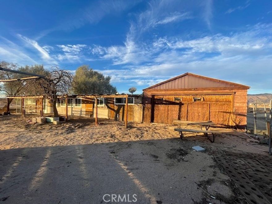 RTI APPROVED PLANS to convert existing rec cabin to SFR 1,426 sqft home with 2 car detached garage (existing) Home features vaulted ceilings , 3 bedroom 2 bath and laundry closet situated on a 5 acre parcel.