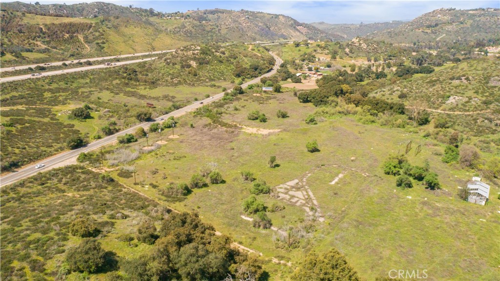 Fronting the east side of I-15 on Champagne Blvd, this 10.05 acre parcel of vacant land is an ideal opportunity. Picturesque views of the surround hills. Previous well drilled on property. Potential for lot split. Don't miss this opportunity!