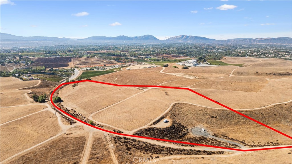 20 Gross Acres in the heart of Temecula Wine Country. PERFECT FOR WINERY-RESORT WEDDING VENUE BUSINESS OR COTTAGE INN INDUSTRY. ZONED WC-W ! Very close in (Right behind the Europa Multi-Winery development. Destined to become Wine Countrys' most premier-upscale future development area. This property qualifies for many uses per the Ordinance 348 specifications for the Temecula Valley Wine Country. The panoramic views are 360 degrees and unforgetable! Come take advantage of the easy access Take La serena, just off Rancho California Road, utilities "Water and Power" in the street. Sewer line (very close) available at Rancho California Road. There is a NEW shared culdesca "Rue Europa- Vineyard Estates" (with improvements in progress), providing additional access to this 20 Acre Parcel along with 4 other parcels. This seller has an ADDITIONAL CONTIGUOUS 20 ACRE PARCEL AVAILABLE (ALLOWING FOR A 40 ACRE - 80 ROOM HOTEL WINERY RESORT OPPORTUNITY). These close in large (20 Acre) parcels provide for a perfect scenario to develop the parcels into their highest and best use per the WC-W zoning. Residentially the property can be divided into 2 Ten Acre estate parcels providing the ultimate Wine Country Estate locations with each 10 Acre Parcel still eligible for the Wine Country "Cottage Inn Money maker. OR become a perfect UPSCALE Family Compoud estate. There are many future development options the owner has in mind (and is willing to share them) providing ideas on how to CUSTOMIZE THE DEVELOPMENT TO A FUTURE OWNERS DESIRE, from a full on operational winery to sub-dividing into (2) Ten Acre Estate properties in which each parcel could accomodate that "COTTAGE INN" 6 unit use . This "close in" excellent opportunity awaits. Zoned WC-W. POWER AND WATER UTILITIES FRONT THE PROPERTY! Adjacent 20 Acre can be negociated in! OPPORTUNITIES ARE ENDLESS!