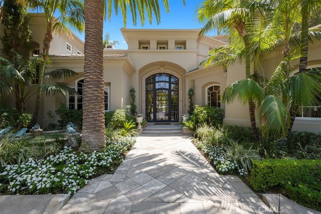 Beautiful, peaceful, premier estate in south orange county. This elegant home provides exceptional privacy and a luxurious, resort-like feel. Each detail of the home adds to the incredible craftsmanship. Offering 8,274 sqft of living space with epic scale, incredible volume, & the finest quality finishes. The home’s limestone fireplaces, crafted wood paneling, custom built in cabinetry the home is truly an example of luxurious living. The home has state of the art technology throughout including Lutron Lighting system and graphical eye controls. There are custom chandeliers throughout the home that are lowered with electric motors. There is an audio system throughout the whole home with an intercom. The outdoor space does not fall short of its own beauty, with a world class style tennis court, beautiful fountain, pavilion style pool house, pool and spa. This estate is truly a masterfully designed work of art.