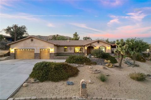 Photo of 7695 Rockaway Avenue, Yucca Valley, CA 92284 (MLS # JT25060722)