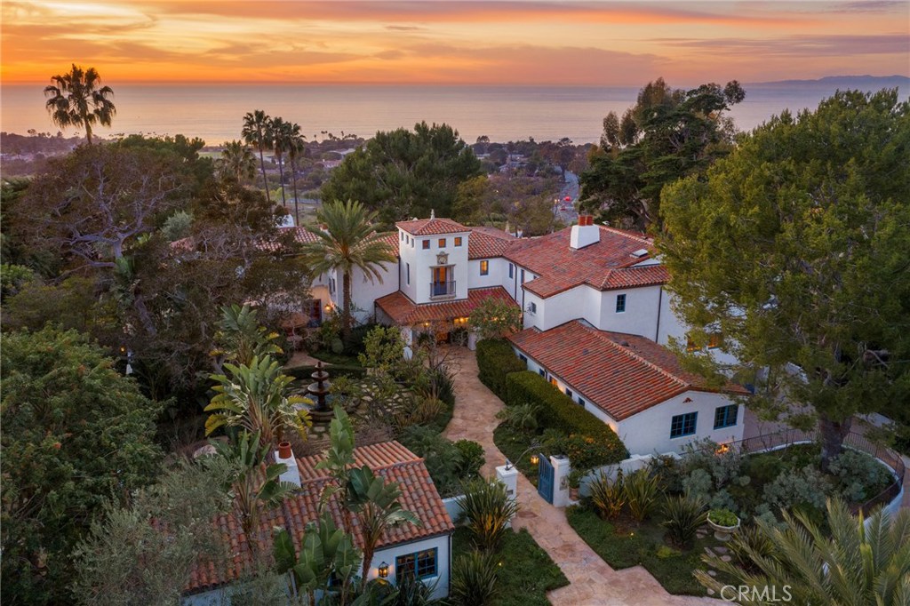 As the gates open and you make your way down the motor court, you might think you’ve arrived at a 5-star resort, but you’ve actually entered your own exclusive hideaway. The "Old Spanish” architecture and stunning stone courtyard retain the charm and character from the 1920’s, but the entire estate was painstakingly reconstructed and expanded in 2006, to take advantage of today's modern luxuries. The ground floor opens to an expansive outdoor veranda, perfectly positioned to take in the commanding ocean and coastline views, and romantic Palos Verdes sunsets. Beyond the spacious living areas and the gourmet kitchen, the home boasts a movie theater, a private tennis court, putting green, both sauna and steam rooms, 7 fireplaces, a 3-stop elevator, 600-bottle wine room, a natural gas powered back-up generator, a 5-car garage and a detached Guest House. The grounds are woven with secret gardens and outdoor treasures. The dramatic pool deck and massive, rolling lawn epitomize its allure. Amenities are aplenty here, so take your time and enjoy each one. Historically known as the "Roessler Estate”, this was home to the first Mayor of Palos Verdes, who, with endless choices of land, knew just how special these 3.17 acres were. History aside, this is one of those special homes… and a once in a generation opportunity.