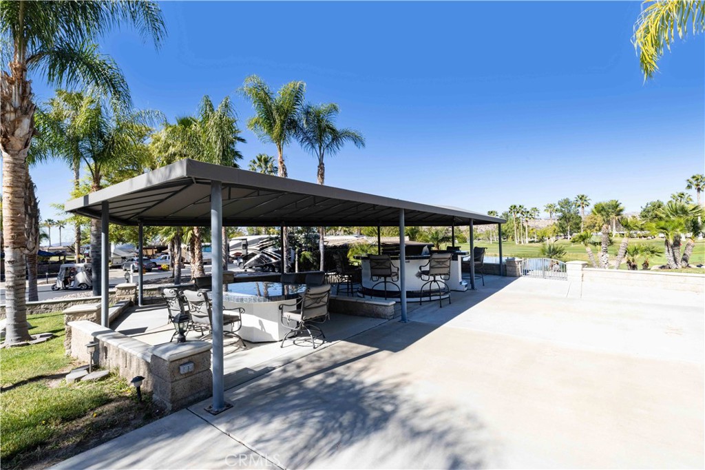 This is the one everyone asks about, first time listed for sale, massive lot with Amazing Golf course, Water and Waterfall views. Sip your coffee on the patio overlooking the 7th hole green and Waterfalls with the sunrise peaking over the trees. Dining area, kitchen area and grass area all inviting company to enjoy the views and the huge property feel. Built-In BBQ and Stovetop Island with lots of storage, second Island with 2 fridges and lots of seating for family and friends to take in the views. Dining area with huge stone table with lots of seating to entertain total of 14 chairs on-site under canvas cover on over 4200 sq ft property. Privacy screens on north side and full privacy hedges on the south side give you a full feeling of outdoor living. Owner may carry financing. Rancho California RV Resort provides amenities such as a 14 hole Executive PAR 3 Golf Course (no fees for owners), 5 Pools/Jacuzzis, Tennis courts, Pickleball courts, Dog park, Club house, hiking trails, Horseshoe lawn and onsite grocery market. The resort is guard gated with no age restrictions. Monthly HOA fee includes unlimited use of the golf course, amenities, trash pickup at lot, water/sewer and common area maintenance. If you are considering a premier Southern California RV destination with convenient access to San Diego, Palm Springs and SoCal beaches, don't miss out on visiting Rancho California RV Resort. **FINANCING AVAILABLE**