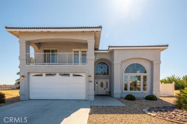 ABSOLUTELY GORGEOUS HOME!! This home is so open and light that you won't want to leave! Beautiful views of the Lake, Front easy maintenance landscaping, with the back yard having luscious green grass, patio, playground, several trees and Vinyl fence for added privacy even has room to build a pool! Huge kitchen with granite counters, stainless steel appliances, walk in pantry, nice, large wet bar, indoor laundry room, large bedrooms with 2 balconies and 3 of the bedrooms have access to these, tons of windows and so much more. Cathedral ceilings, extra spaces such as a family room, dining room or office, huge master bedroom with large master bath including a separate tub and shower. Kitchen is open to the living room with fireplace. Garage is large with lots of storage room, door to the side yard and walking distance to lakes and parks. Silver Lakes is a private community between Victorville and Barstow. Your monthly HOA dues include use of all of the amenities including a 27 hole golf course, tennis courts, Bocce ball courts, Pickle Ball courts, gorgeous clubhouse, library, Olympic sized swimming pool, 24 hr gym, equestrian facilities so you can stable your horses, Beach and boat launch, two beautiful lakes for fishing boating, kayaking, paddle boarding, and even windsurfing! Association Amenities: Beach # of RV Spaces: 0 Special Features: ,,PTRY,WBPOOL,CLUB,SPA,TENN,PIER,BEAC,GOLF Lot Location Type: Standard Location Patio and Porch Features: Balcony Pool Features: Common Pool Special Features: Cable TV,Garage Door Opener # of Attached Spaces: 2 # of Detached Spaces: 0