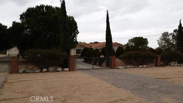Beautiful 4 bedroom, 2 bath, horse property home where the sunsets are breath taking and all four seasons are felt. This home boasts a fully fenced lot with custom red brick pillars in the front gate entrance. The driveway to the homes 2 car garage features a large circular concrete driveway surrounded by junipers which provide the ultimate in privacy. As you enter the main entrance of the home you are welcomed by a large living room that encourages an intimate setting for spending time, relaxing with those who are loved. Enjoy a nice fire in the family room over looked by an open kitchen design. This home also features an additional large detached 2 car garage/work shop at the rear of the lot with a separate private driveway entrance for your RV or any other toys you may have or parking you may need. Enjoy the sunsets with family and friends in the fully covered, extra wide rear patio. You will surely notice the pride of ownership throughout this lovely desert gem of a home. Association Amenities: None, Garage # of RV Spaces: 0NONE,GARG Lot Location Type: On Equestrian Area Special Features: None # of Attached Spaces: 2 # of Detached Spaces: 2