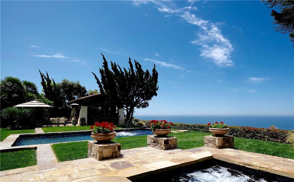 Enjoy breathtaking views of the Pacific Ocean, Catalina Island, and brilliant coastal sunsets from all major rooms of this White Sails beauty. At approx. 5477 sq ft, home includes 4 bedrooms with study/optional 5th bedroom, 4 full and 2 half baths, and bonus room. One of the largest, best view lots in White Sails w/ approx. 17,940 sq ft (including 1680 sq ft fenced slope area) on quiet, single loaded street away from traffic. The home, with downstairs master suite, boasts a first floor lifestyle with gorgeous salt water pool and separate spa. Main living areas open to large interior courtyard w/ custom stone wood burning fireplace. Gourmet kitchen w/ separate bar area opens to dining and great room. Butler's pantry area has large Sub-Zero refrigerator, 80" wine refrigerator, 2nd dishwasher, and farmhouse sink. Covered cabana has full outdoor kitchen. A wood burning fireplace and stone dining bar complete this outdoor living area. Private front courtyard with stone fountain and security gate. Spectacular finished garage with extensive custom Baldhead metal cabinets and epoxy coated garage floor. 6 car parking includes 3 car garage and 3 car driveway.
1 M+ in upgrades. Home and landscape are meticulously maintained in pristine condition.