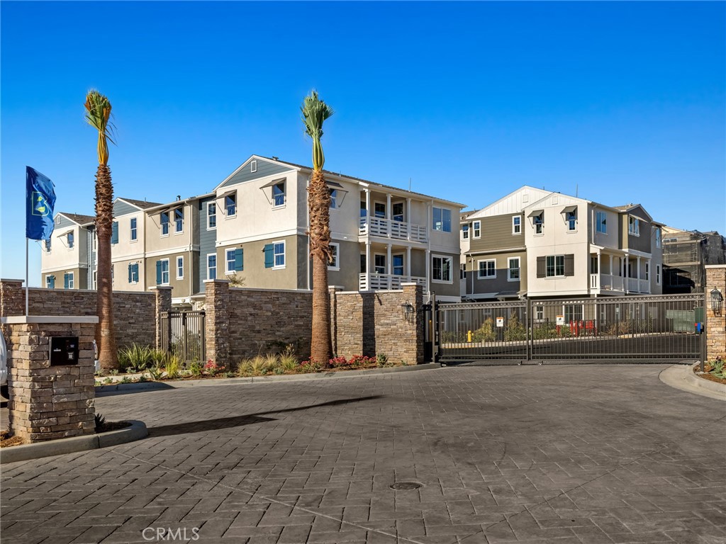 On a corner location, this spacious floorplan has all bedrooms on the 3rd floor, White Thermofoil cabinetry with stainless steel appliances and kitchen island, Simply White Quartz Countertops throughout. Large format, luxury vinyl plank flooring and tile completes this home. Also enjoy a private deck - the perfect place to entertain or just relax. Welcome to Carson Landing! An exciting, new, gated community with coastal-inspired architecture, an abundance of amenities and a central location making the most of L.A., Long Beach, and Orange County. Carson Landing is very conveniently located to the 91, 710, 110, and 405. Cal State Dominguez Hills, Dignity Health Sports Park, Harbor UCLA Medical Center, abundant shopping, dining, and recreation are all nearby as well