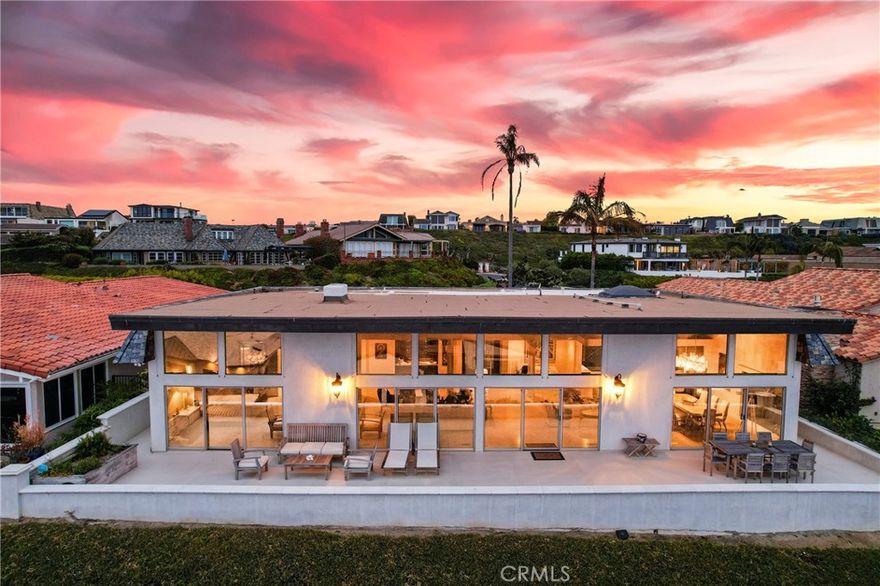 Truly an incredible opportunity for a "Single Level" custom home with spectacular "Ocean, White Water and Catalina Views" located within the coveted 24-hr guard gated community of Niguel Shores! This extremely open and spacious (approx) 3400sqft residence, is light and bright boasting the "Great room concept" containing 3 bedrooms, 3 baths, cathedral ceilings, floor to ceiling windows/doors, a dramatic custom fireplace located in the living/family room, a separate office/den, oversized main floor laundry room with sink, stone counters & skylight, newer heating and air conditioning system, electric draperies, bar area with wine cooler, a center island gourmet kitchen featuring stainless steel appliances inclusive of a Thermador 6- burner range, double ovens, built-in Refrigerator/freezer, microwave, warming drawer, dishwasher, custom cabinetry as well as custom granite countertops. Skylights located in the kitchen, laundry and office/den area allow an abundance of natural light within the residence. This "no steps" single level residence is situated on approximate 7500sqft site, contains a large grass courtyard area ideal for pets and entertaining. This "non- descript" custom residence features an outstanding rear yard deck displaying phenomenal ocean and panoramic views of both Catalina and San Clemente islands, provides for incredible "indoor/outdoor" entertaining and living! The master suite contains floor to ceiling doors/windows, walk-in closet, two separate vanity areas, jacuzzi-type tub and walk-in shower. A secondary bedroom, contains direct access to the front courtyard! Additionally, there is an oversized 3-car garage with multiple openers, built-in cabinetry, epoxy floors and significant additional lighting. Throughout the residence is the lavish use of stone including  honed Crema 24x24 Marfil flooring from Spain, Quartz plus Juparana and Barricato granite. Walk to the Ritz Carlton Resort as well as the world renowned Salt Creek Beach with its surfing breaks and the sands of the Pacific Ocean. Minutes to the Dana Point Harbor and its Lantern District with its numerous dining and shopping establishments. This 24-hr guard gated "oceanfront" community has direct beach access and a bluff top "ocean front" park. The HOA amenities including tennis, pickle ball, Jr Olympic sized pool, sports courts, playground, barbeque area, recreation center and more! Seldom do these "ocean close" single level homes come to our market place with this location!