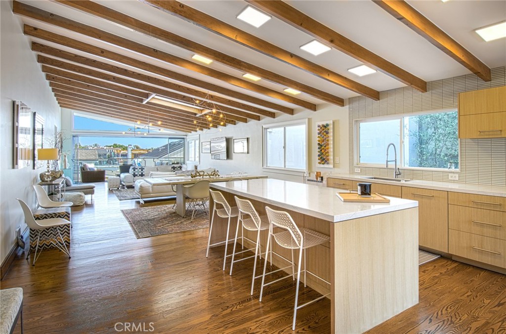 SHORT TERM, FULLY FURNISHED, MONTHLY VACATION RENTAL. Our charming beach cottage is getting a makeover and will be ready to welcome new guests beginning April 1st. Located in the heart of Corona Del Mar, on the flower streets south of PCH, this elegantly remodeled 4 bedroom beach cottage awaits you. The open concept merges the kitchen with the living space and flows through a wall of sliding glass doors onto the attached view deck. Enjoy the warm summer nights on the deck around the fire with your favorite beverage or just spend your day relaxing with a book. The main floor is complete with two secondary bedrooms and the master bedroom that opens onto the deck as well. Downstairs you will find an oversized bedroom with access to the lower deck that provides direct access to Hazel Street and easy access to the beach. A full bathroom, with laundry closet, complete the downstairs. Great location, close to restaurants and shopping on PCH and just steps away from the beach. This is the perfect place for your next getaway! Premium rates apply during summer months.