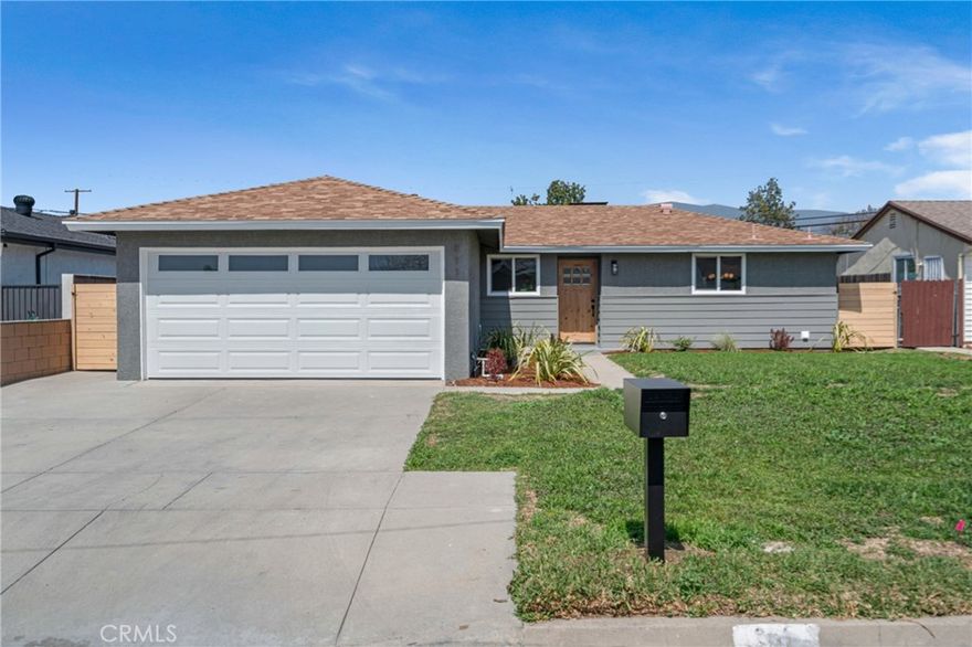 Welcome to 911 E Gaillard St, a beautifully updated 4-bedroom, 2-bathroom single-family home in the beautiful city of Azusa! Featuring stylish finishes and an expansive backyard, this single-story gem offers open-concept living and plenty of outdoor space, perfect for entertaining or expanding. Step into the fully remodeled kitchen, showcasing sleek granite countertops, stainless steel appliances, and modern shaker-style cabinets with soft-close drawers.  The kitchen also offers convenient access to the side yard. Beautiflly updated light-tone flooring runs through the home adding that elegant touch.

The dining area, illuminated by a chic, modern chandelier, flows seamlessly into the spacious living room, where a white brick fireplace adds warmth and charm. French doors lead to the private backyard, fully fenced for privacy. The full bathroom off the main living area features a single-sink vanity, a tub/shower combo with a subway tile surround, and stylish modern flooring. Down the hall, all four bedrooms are comfortable and bright, each equipped with overhead lighting and closets. The second bathroom offers a walk-in shower with a subway tile surround, a single-sink vanity, and granite tile flooring. Central A/C and heat provide year-round comfort. 

The two-car attached garage provides ample storage and parking.

Outside, enjoy a large grassy lawn, concrete area for outdoor dining, and a basketball half-court with a hoop—there’s even enough room to add a small ADU. 

This move-in-ready Azusa gem offers both modern comforts and outdoor versatility, making it an exceptional find. Don't miss out! Schedule your personal showing appointment today!