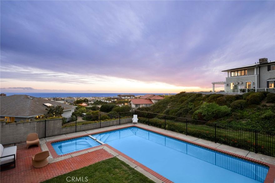 Set in Harbor View Hills South, this property features panoramic ocean views, overlooks the community greenbelt, and has vistas of the Pelican Hill golf course.