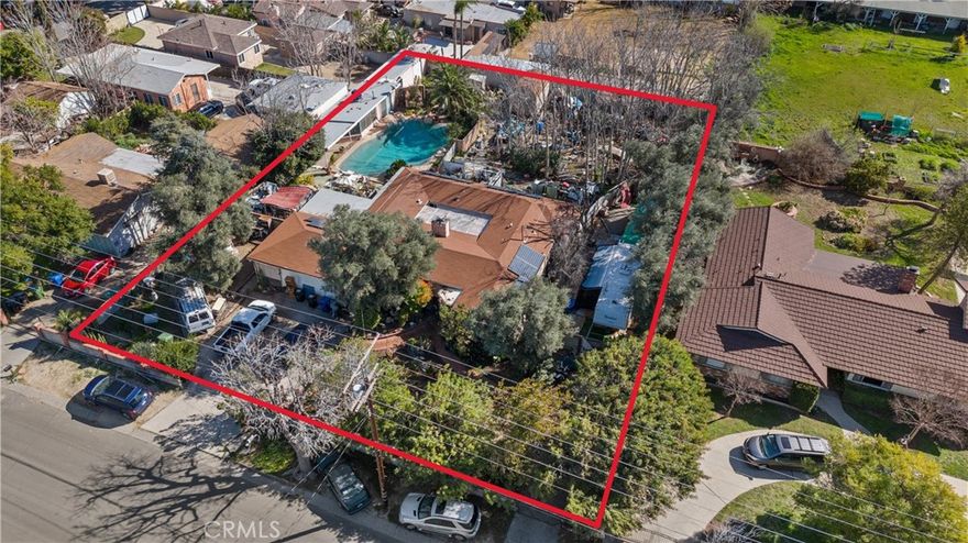 CALLING ALL CASH BUYERS - INVESTOR DELIGHT - SUPER GRAND SIZE LOT WITH SPRAWLING ONE STORY AND CASITA!!!  AND POOL AND YOU CAN HAVE HORSES/LIVESTOCK!!!   This sprawling and massive property offers a unique opportunity for horse enthusiasts and those seeking a spacious and customizable living space inside and out. ONE STORY HOUSE, GUEST HOUSE, RV PARKING, FARM AREA AND AMPLE SPACE! Could have great curb appeal! House has a fabulous atrium at the center of the house brings life to the possible of nature and vibe that can be created in the home.  Situated on a generously sized lot of approximately 22,000 sq.ft., this one-story home boasts a pool, guest house, and a fantastic floor plan of 3-bedroom, 2-bathroom layout. With its wide curb appeal, this property presents endless possibilities for personalization and creating your dream home and dream lifestyle. Don't miss out on this wonderful chance to own a gorgeous property that combines both comfort and potential. Great freeway access to all. Horse / Livestock / Car enthusiast / Contractors / Everyone that wants space - This could be the one to make into yours! Fantastic with abundant RV access!  Bring your tool belt! Needs A LOT OF TLC! BRING YOUR CONTRACTOR!