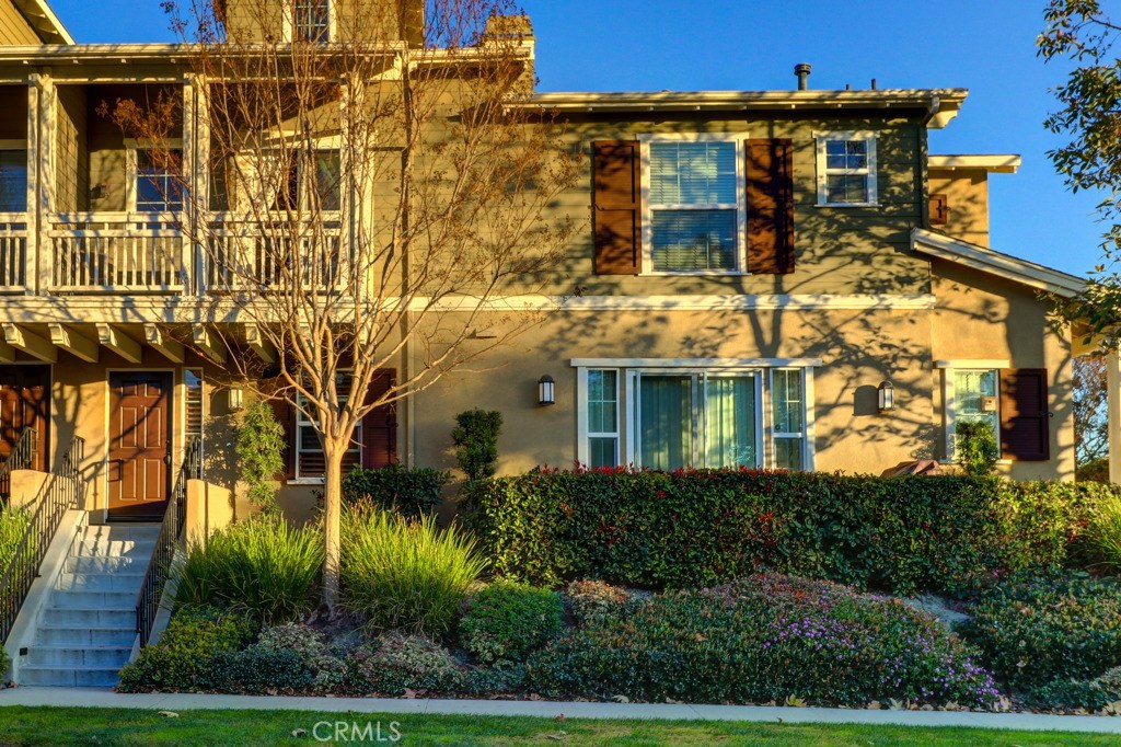 Gorgeous townhouse with 2 Master bedrooms plus a large loft, 2.5 baths and a great location in the heart of Ladera Ranch. Main floor bedroom with own full bath and built-in desk. Open and bright home with lots of windows and plantation shutters and upgraded flooring. This beautiful home also offers a large living room with high ceiling, a cozy fireplace and sliding glass door access to a large balcony. Gourmet kitchen with granite counter tops, recessed lighting and upgraded tile flooring. Spacious master suite features a walk-in and regular closet, dual vanity, oval bathtub and shower. Large loft can be used as an office, playroom or converted to the 3rd bedroom. Spacious laundry room with cabinet storage. Two car attached garage and additional parking on the street in front of property. Close to Ladera Ranch amenities such as award winning schools, parks, pools, tennis courts, water park, skate park, hiking & biking trails, shopping and dining. HOA INCLUDES FREE INTERNET!