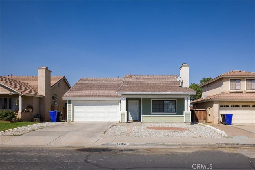 NEW Flooring installed throughout the entire house. Welcome to High Desert living! This charming home is located in the community of Victorville. This home offers 1,464 square feet of living space, featuring three bedrooms and two bathrooms, as well as a living room, dining area, and kitchen. As you approach the home, you'll instantly notice the curb appeal and pride of ownership; the low maintenance and water-wise landscaping will make upkeep a breeze. The covered porch offers a cozy space to enjoy your morning coffee and the starry evenings. Upon entry, you will be welcomed by tile flooring and a quaint shelf, perfect for keeping your belongings organized and ready to grab when you're on the go. The entryway connects to the living room with large windows to allow the perfect amount of sunlight to spill in. The kitchen features laminate countertops, a freestanding range, mounted microwave, dishwasher, and bay window over the sink. The kitchen opens to a spacious breakfast nook which will easily accommodate a table full of guests for holiday gatherings, or quiet dinners at home. The breakfast nook also has sliding door access to the backyard. Two bedrooms with closets offer plenty of space, and share a hallway bathroom. The master suite features dual closets, sliding door access to the backyard; the attached ensuite includes a dual sink vanity and a shower. The two car attached garage provides direct access to the home. The private, fenced backyard space includes a covered patio, and plenty of space for play, gardening, and relaxation in the warm California sunshine and evenings under the desert sky. The carpet and tile floors were removed and replaced with new luxury vinyl plank flooring on 12/30/22. All potential residents 18 or over must complete an application and credit check. Renters should make 3 times the rent($6000) monthly and pass a credit check. *Virtual tour was taken prior to the new flooring being installed*
