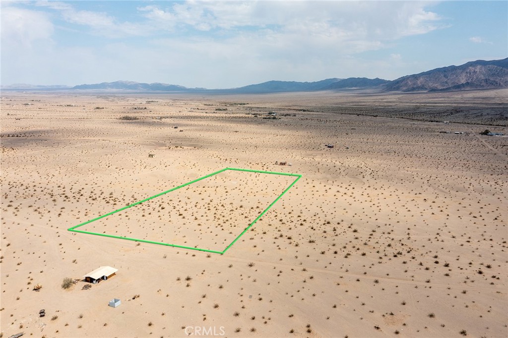 Looking for Remote? You found it! Located in the hard of Wonder Valley, panoramic views in every direction. Perfect for weekend camping or a long term investment hold. Drilling a well is required for a water supply if one decides to build and solar for electricity at the edge of the earth location. Note: Green lines demarcating boundaries in pictures are approximate, property has not been surveyed; APN: 0627-251-15