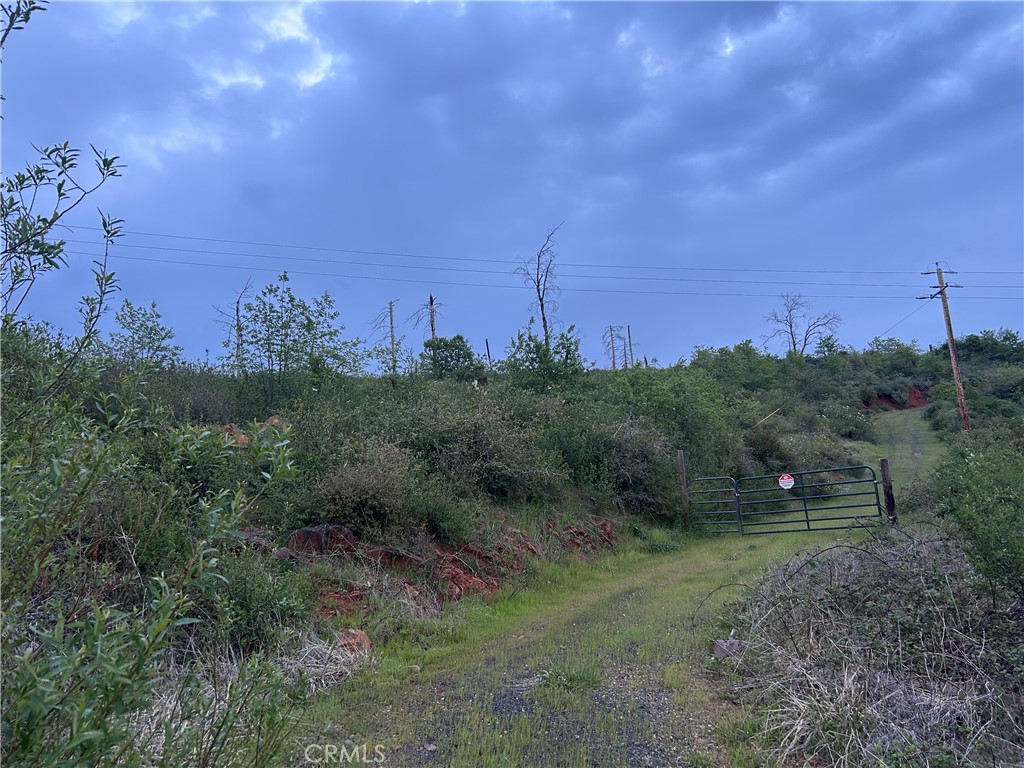 big parcel on a paved road. secluded with lots of improvements to the land. well was operational before the fire