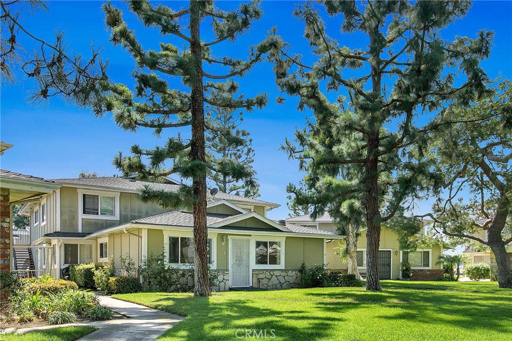 End-unit, single story townhome in the Huntington Gardens community of Huntington Beach. No neighbors above or below you. Laminate wood floors, newer windows and central air conditioning compliment this two-bedroom home. Enter into the inviting living room which seamlessly flows to the dining area with ceiling fan and upgraded kitchen with solid wood cabinets, Corian counter top and breakfast bar. The bedrooms are generously sized and share the full, upgraded hall bathroom. Convenient enclosed 2 car shared garage with additional storage and plenty of open space parking. Communal laundry room dedicated to the four-unit building. Water, sewer, trash, common area maintenance and HOA amenities are included in the HOA dues. The community includes a refreshing swimming pool (gated) and is conveniently located near to several restaurants, Bella Terra mall, Movie Theater, parks, schools, beach access and the 405 freeway. Come quick, this one will not last long!