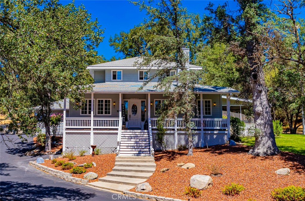Step into a serene community with this exquisite turnkey mountain home. Boasting attention to detail throughout, this residence offers a blend of elegance and comfort. With 140 acres of beautiful meadows and 6 miles of footpaths, you can hike to your heart's content or just enjoy the peaceful nature that surrounds this community of Sierra Meadows. And with BLM property behind your home, never worry about any construction there! Did I mention the new roof installed in October of 2023? Upon entering this custom home, you're greeted by a charming parlor, leading to a spacious living room adorned with a marble fireplace. The dining room, featuring a tray ceiling and exquisite built-in cabinets, seamlessly flows into the large kitchen complete with an eating area and butler's pantry. This 4-bedroom, 3-bathroom home also includes a private office, living room and a large den equipped with a pool table. Gather in the expansive enclosed patio/sunroom featuring a fire pit, perfect for entertaining guests. For the avid car enthusiast, the attached 3-car and a hidden gem awaits with a secluded 5th room tucked away off the detached shop/boathouse, boasting its own quaint front porch. Nestled within a lush park setting spanning 1.69 acres, this 3534 sq-foot custom home offers a sanctuary with 5 minute access to Oakhurst amenities. Don't miss out on this turnkey custom home! Schedule a viewing today to truly appreciate its charm and allure.