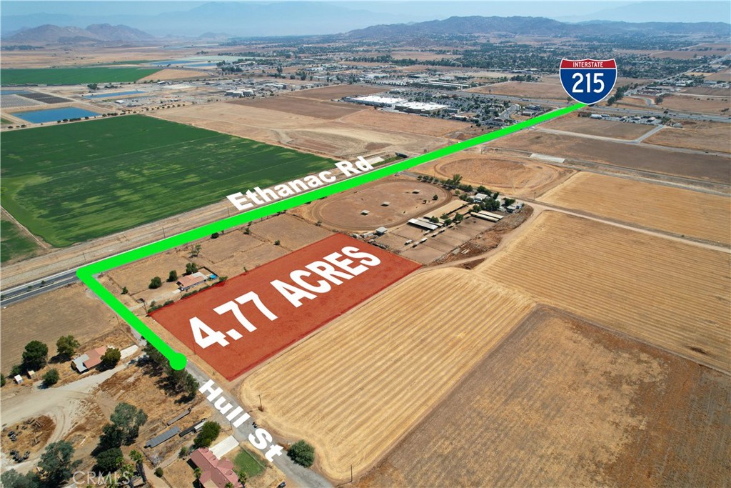 Location, Location, Location... RARE land development opportunity 4.77- acre lot, just blocks off Ethanac Rd exit on the 215 Fwy and close to large retailers - Home Depot, Starbucks, Autozone, Winco Foods, and plenty more. The Economic Development Corridor - Northern Gateway (EDC-NG) zoning positions this property as a key player in a fast-growing warehousing and heavy industrial area of Menifee. Benefit from the City of Menifee's $130 million investment in capital improvements, improving roads and traffic flow. The planned extension of Ethanac Rd. to connect to CA-74 will considerably raise the traffic count to 40,000+, bringing even more visibility to this area. Nearby are the Perris Logistic Centers with 4 million square feet of rentable space, a 28 acre industrial neighbor blocks away, Seasons by Green Valley Ranch new construction housing development, as well as hundreds of current and proposed corporate neighbors. This lot is flat and has water, sewer, and electricity very close by.